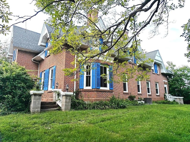 12 Monell Pl, Beacon, NY 12508 - view of side of home with brick siding, a yard, and roof with shingles