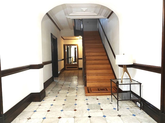 12 Monell Pl, Beacon, NY 12508 - stairway featuring arched walkways, ornamental molding, and tile patterned floors
