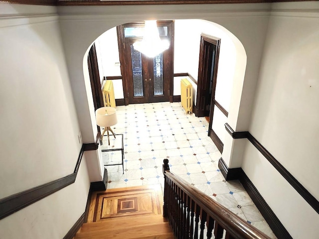 12 Monell Pl, Beacon, NY 12508 - staircase featuring arched walkways, tile patterned floors, and radiator heating unit