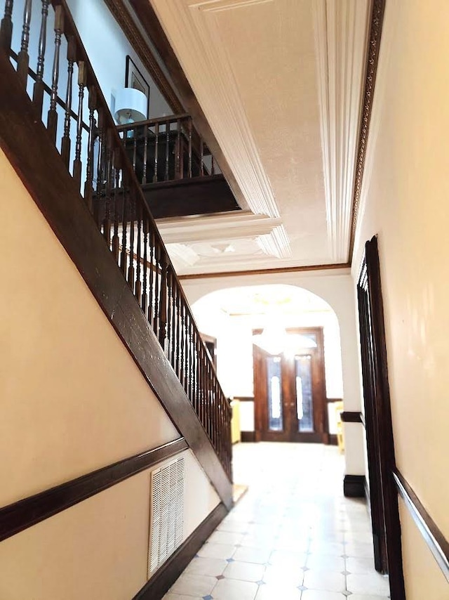 12 Monell Pl, Beacon, NY 12508 - staircase with ornamental molding and tile patterned floors