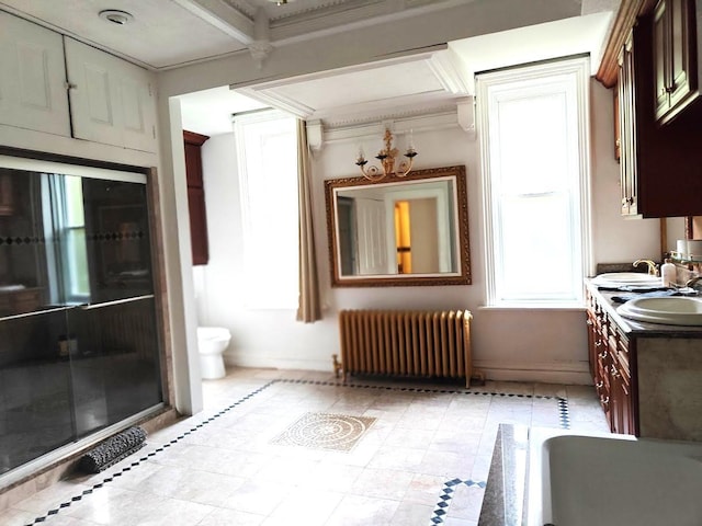 12 Monell Pl, Beacon, NY 12508 - kitchen featuring radiator and crown molding