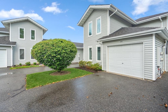 914 Fenway Rd, Saint James, NY 11780 - view of side of home with a garage, asphalt driveway, and roof with shingles