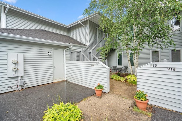 914 Fenway Rd, Saint James, NY 11780 - entrance to property featuring a patio area and a shingled roof