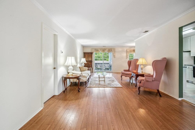 914 Fenway Rd, Saint James, NY 11780 - living area featuring light wood-type flooring and ornamental molding