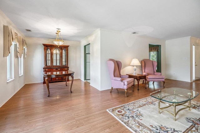 914 Fenway Rd, Saint James, NY 11780 - living room featuring crown molding, healthy amount of natural light, and light wood-style floors