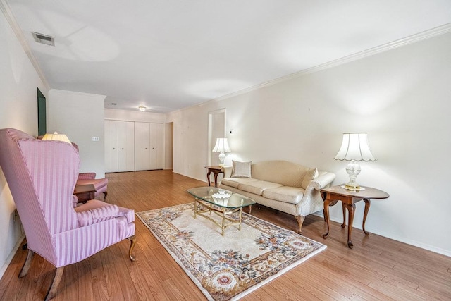 914 Fenway Rd, Saint James, NY 11780 - living area featuring crown molding and wood finished floors