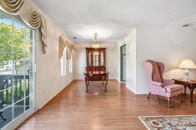 914 Fenway Rd, Saint James, NY 11780 - dining room featuring light wood-style floors and ornamental molding