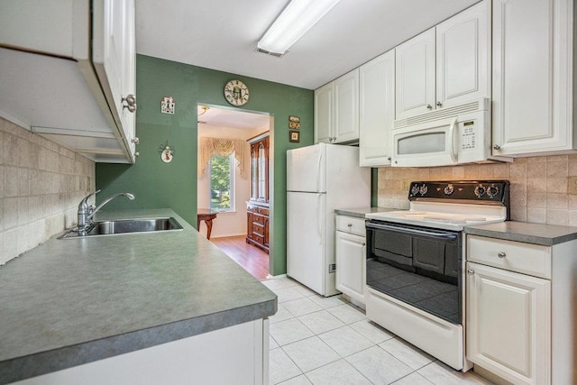 914 Fenway Rd, Saint James, NY 11780 - kitchen featuring white appliances, backsplash, white cabinetry, and light tile patterned floors