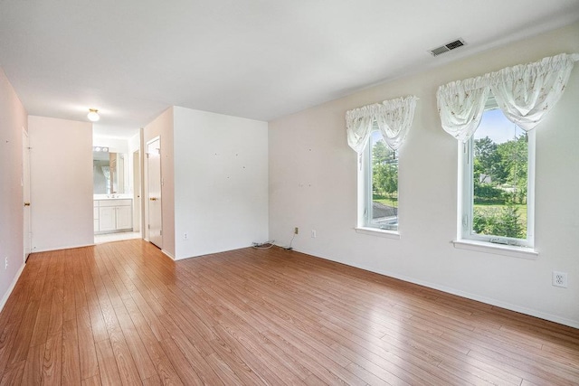 914 Fenway Rd, Saint James, NY 11780 - unfurnished room featuring light wood-type flooring and plenty of natural light