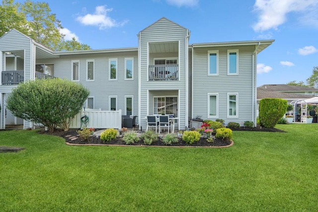 914 Fenway Rd, Saint James, NY 11780 - rear view of property featuring a yard, a balcony, and a patio