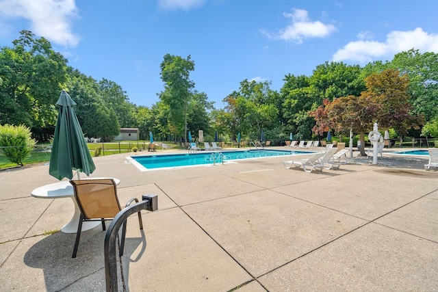 914 Fenway Rd, Saint James, NY 11780 - community pool with a patio area and view of wooded area