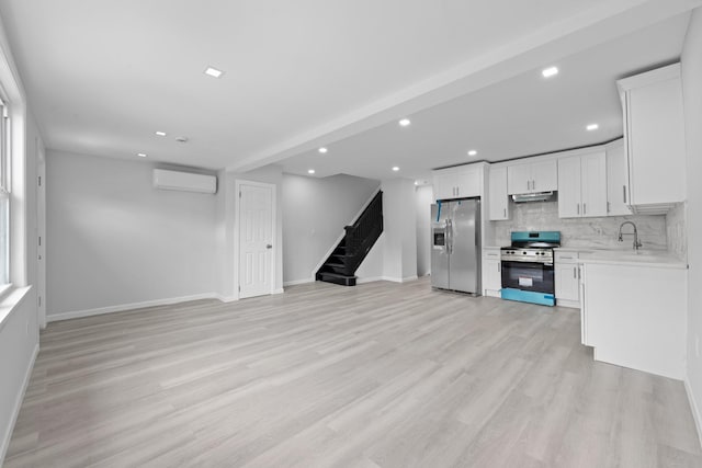 19432 113th Rd, Hollis, NY 11412 - unfurnished living room with stairs, light wood-type flooring, recessed lighting, and a wall mounted AC