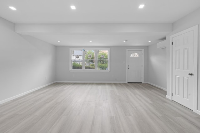 19432 113th Rd, Hollis, NY 11412 - foyer entrance featuring a wall unit AC, recessed lighting, and light wood-style floors