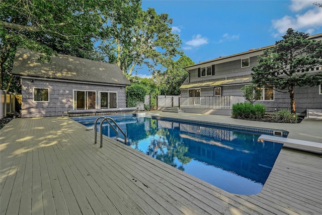 31 Neptune Ave, Mastic, NY 11950 - view of swimming pool with a wooden deck and a diving board