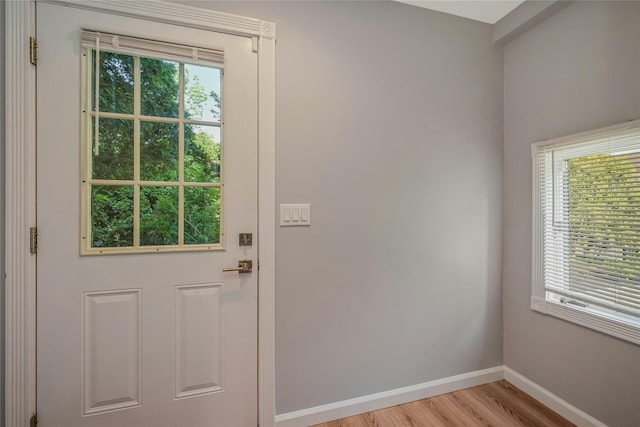 31 Neptune Ave, Mastic, NY 11950 - doorway featuring baseboards and light wood finished floors