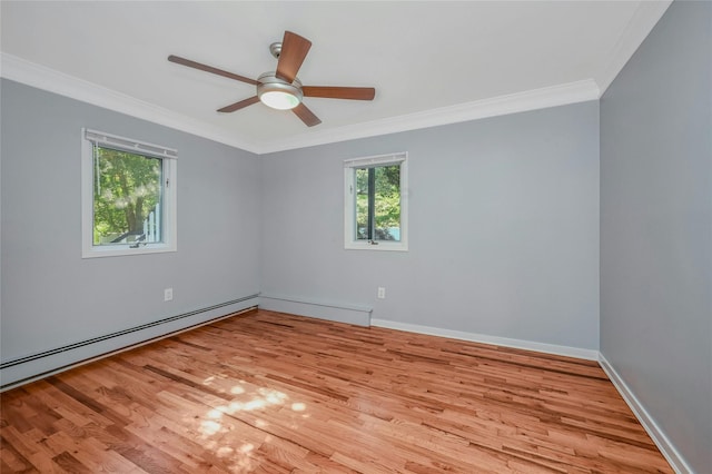 31 Neptune Ave, Mastic, NY 11950 - empty room featuring crown molding, wood finished floors, a ceiling fan, and baseboard heating