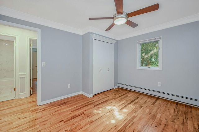 31 Neptune Ave, Mastic, NY 11950 - unfurnished bedroom featuring light wood-style floors, a baseboard heating unit, crown molding, a closet, and ceiling fan