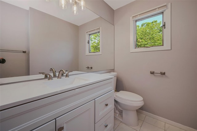 31 Neptune Ave, Mastic, NY 11950 - bathroom with healthy amount of natural light, vanity, a chandelier, and tile patterned flooring