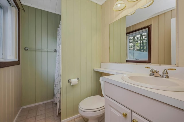 31 Neptune Ave, Mastic, NY 11950 - full bathroom with vanity, wood walls, tile patterned flooring, and a shower with shower curtain