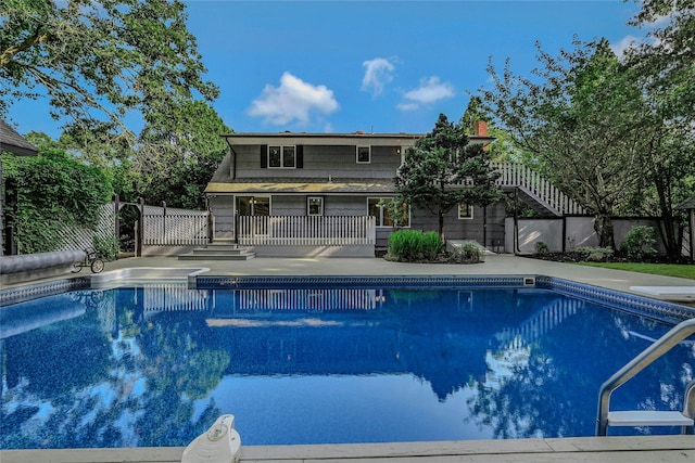 31 Neptune Ave, Mastic, NY 11950 - swimming pool featuring a patio