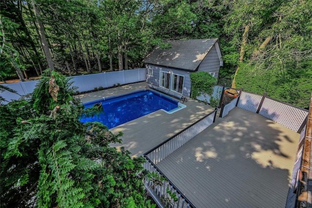 31 Neptune Ave, Mastic, NY 11950 - view of pool with a fenced backyard, an outdoor structure, and an exterior structure