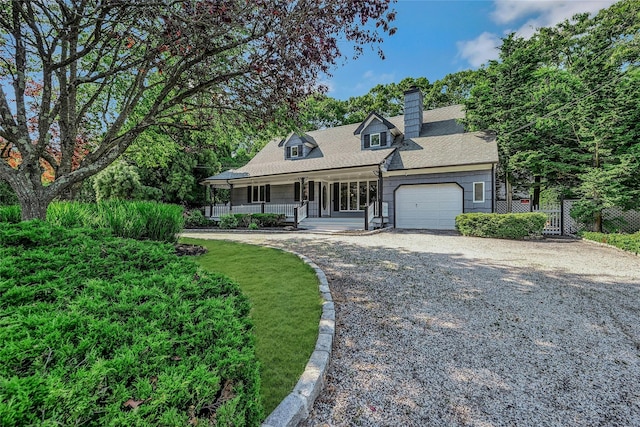 31 Neptune Ave, Mastic, NY 11950 - cape cod home featuring covered porch, driveway, an attached garage, and a chimney