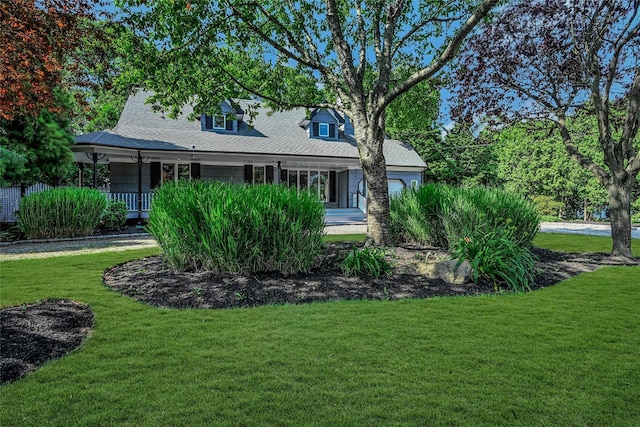 31 Neptune Ave, Mastic, NY 11950 - new england style home featuring a front lawn, covered porch, and a shingled roof