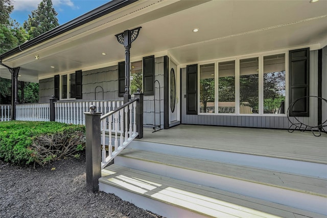 31 Neptune Ave, Mastic, NY 11950 - doorway to property with a porch