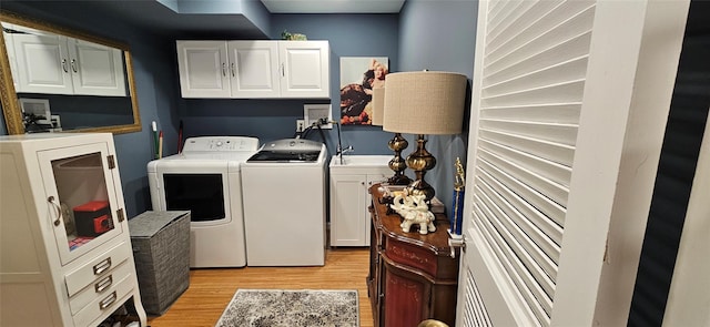 12 Omni Parc Dr, Nanuet, NY 10954 - washroom featuring cabinet space, washer and clothes dryer, and light wood-style floors