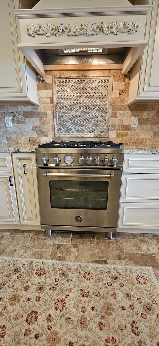 12 Omni Parc Dr, Nanuet, NY 10954 - kitchen featuring high end stainless steel range oven, stone tile floors, tasteful backsplash, and light stone counters