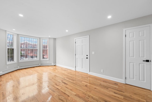 1070 Kelly St, Bronx, NY 10459 - empty room featuring light wood-style floors and recessed lighting