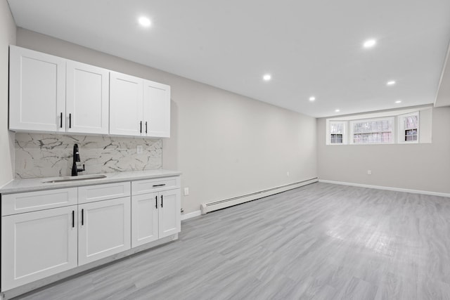 1070 Kelly St, Bronx, NY 10459 - bar area featuring a baseboard heating unit, backsplash, recessed lighting, and light wood-style flooring