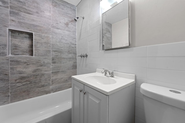 11501 Linden Blvd, South Ozone Park, NY 11420 - bathroom featuring tile walls, vanity, and shower / tub combination