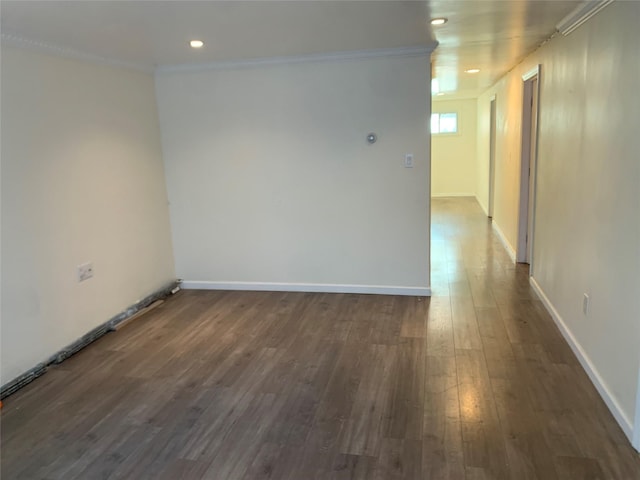 6 2nd Pl, Roosevelt, NY 11575 - unfurnished room with dark wood finished floors, ornamental molding, and recessed lighting
