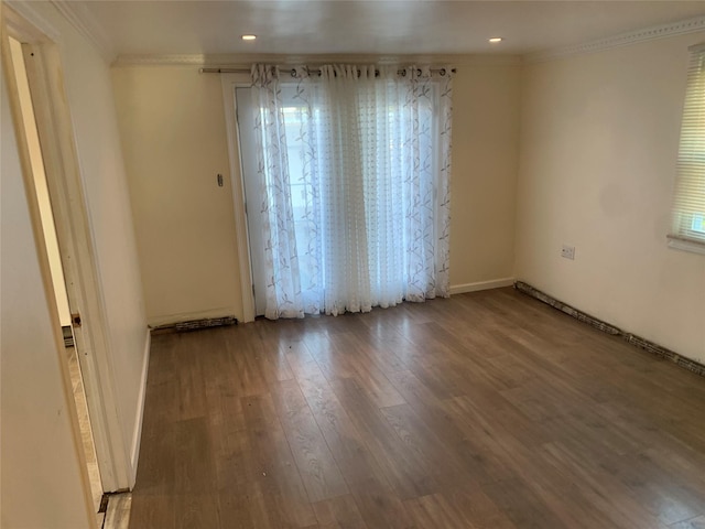 6 2nd Pl, Roosevelt, NY 11575 - empty room with ornamental molding, wood finished floors, recessed lighting, and healthy amount of natural light