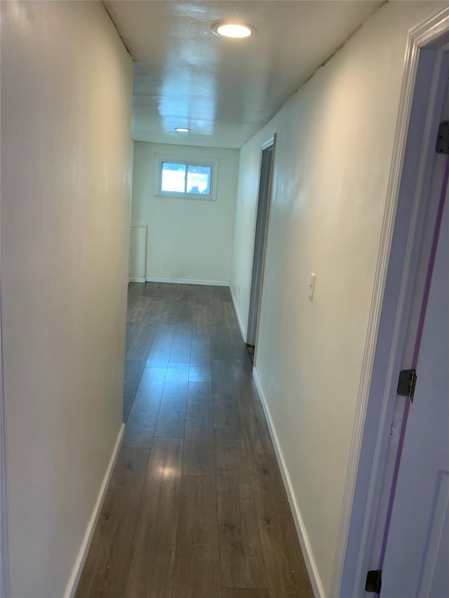 6 2nd Pl, Roosevelt, NY 11575 - hallway featuring dark wood-type flooring and baseboards