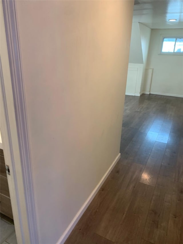 6 2nd Pl, Roosevelt, NY 11575 - corridor with dark wood-type flooring and baseboards