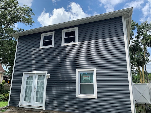 6 2nd Pl, Roosevelt, NY 11575 - view of property exterior featuring french doors