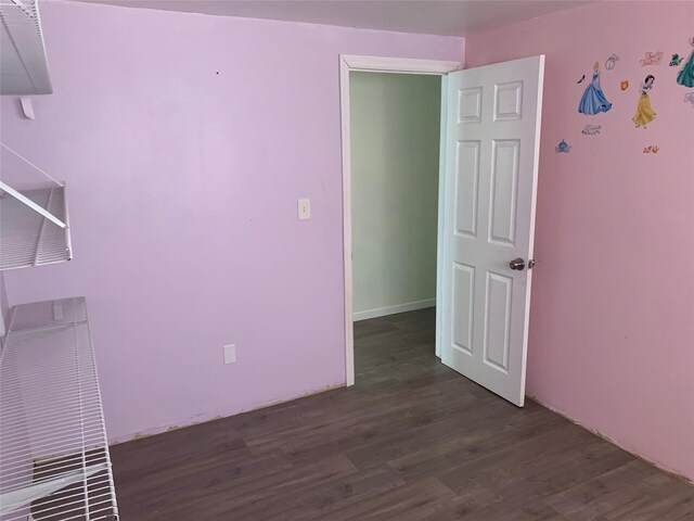 6 2nd Pl, Roosevelt, NY 11575 - spare room featuring dark wood finished floors
