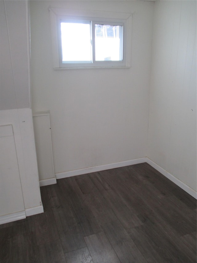 6 2nd Pl, Roosevelt, NY 11575 - spare room featuring dark wood finished floors