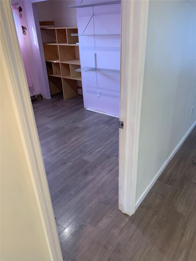 6 2nd Pl, Roosevelt, NY 11575 - hall with dark wood-style floors and baseboards