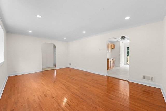 690 Corbalis Pl, Yonkers, NY 10703 - spare room with arched walkways, light wood-style flooring, ceiling fan, recessed lighting, and ornamental molding
