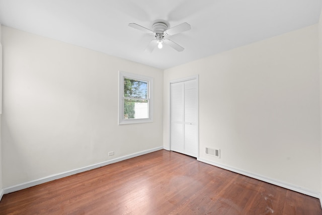 690 Corbalis Pl, Yonkers, NY 10703 - unfurnished bedroom featuring wood finished floors, a closet, and a ceiling fan