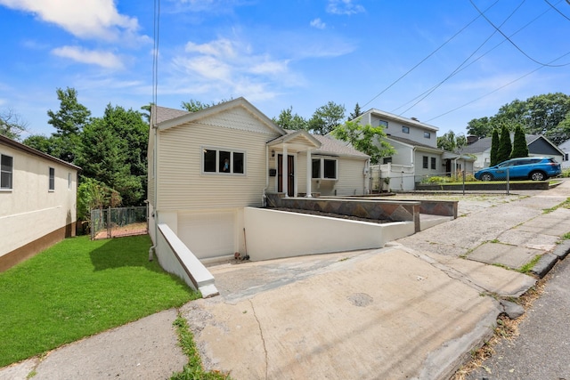 690 Corbalis Pl, Yonkers, NY 10703 - view of front of home featuring an attached garage and concrete driveway