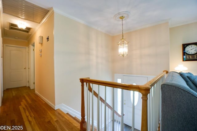 193 Washington Ave, Tappan, NY 10983 - corridor featuring an upstairs landing, wood finished floors, ornamental molding, and a chandelier
