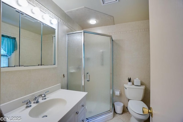 193 Washington Ave, Tappan, NY 10983 - bathroom with a shower stall, vanity, tile walls, and tile patterned flooring