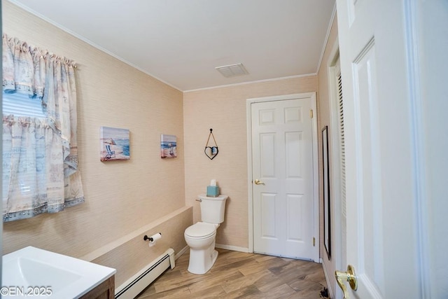 193 Washington Ave, Tappan, NY 10983 - bathroom with a baseboard heating unit, crown molding, wood finished floors, and vanity