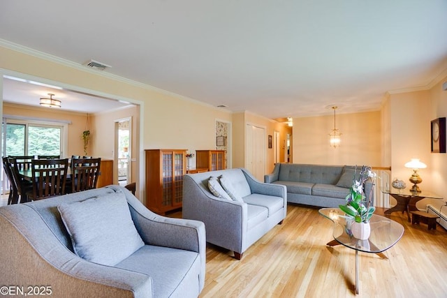 193 Washington Ave, Tappan, NY 10983 - living room featuring light wood finished floors and ornamental molding
