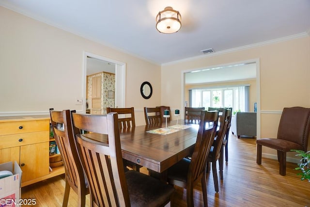 193 Washington Ave, Tappan, NY 10983 - dining space featuring crown molding and wood finished floors