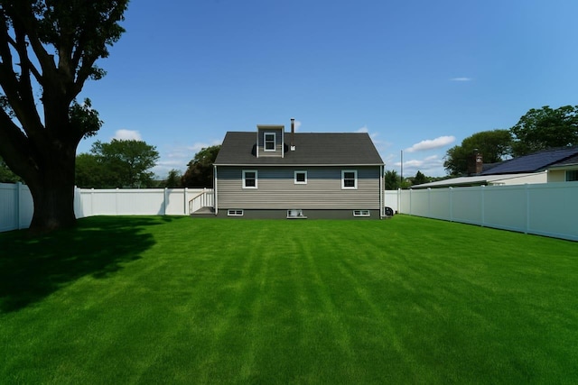 280 Neptune Ave, West Babylon, NY 11704 - rear view of house featuring a fenced backyard